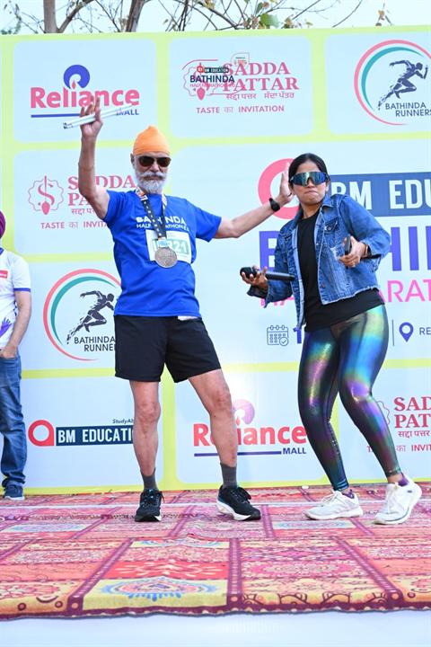 Runners celebrate on stage after finishing Bathinda Half Marathon 8.0
